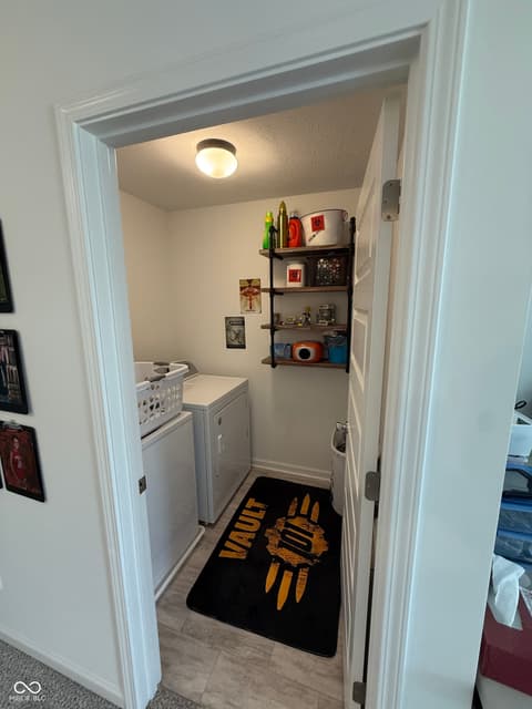Laundry room at 13755 George Court, Camby, IN
