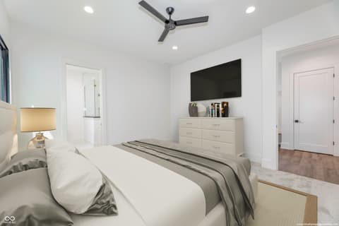 Primary bedroom at 8694 Morgan Drive, Fishers, IN — Spacious modern primary suite with luxury en-suite bathroom.
