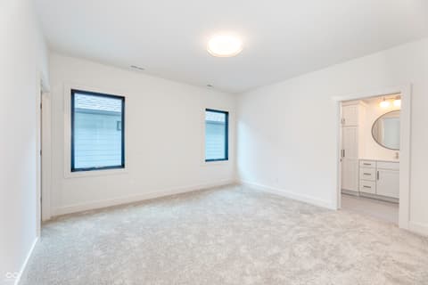 Primary bedroom at 8694 Morgan Drive, Fishers, IN — Bright primary suite with ensuite bathroom access.