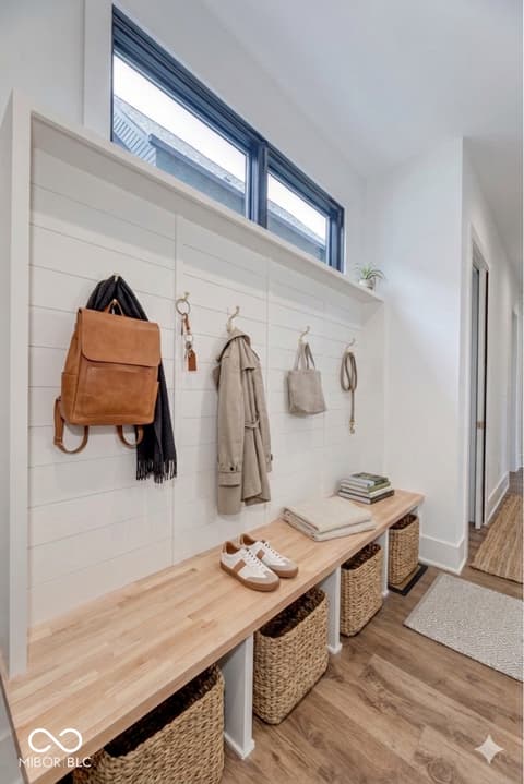 Foyer at 8694 Morgan Drive, Fishers, IN — Bright, organized mudroom with custom built-in storage.