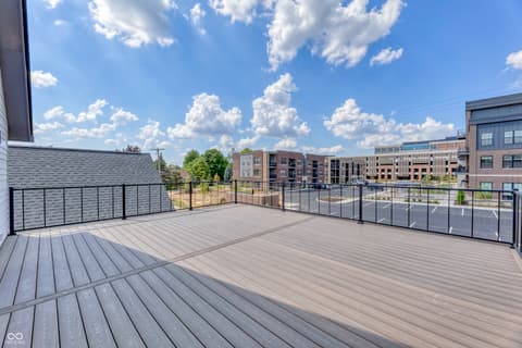 Outdoor living area at 8694 Morgan Drive, Fishers, IN — Spacious rooftop deck with panoramic city views.