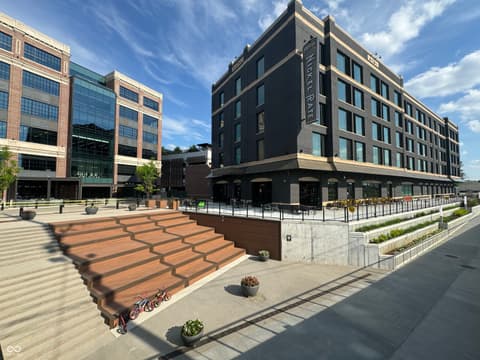Front exterior at 8694 Morgan Drive, Fishers, IN — Modern urban mixed-use development with vibrant plaza.