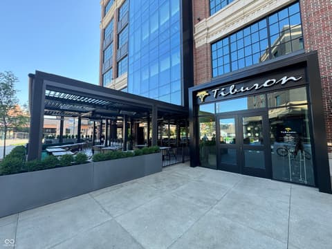 Outdoor living area at 8694 Morgan Drive, Fishers, IN — Modern outdoor space with pergola in mixed-use development.