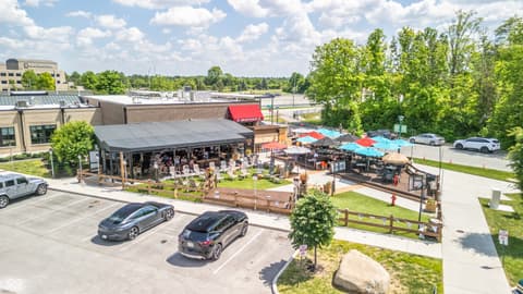 Front exterior at 8694 Morgan Drive, Fishers, IN — Modern outdoor venue with covered patio and ample parking.