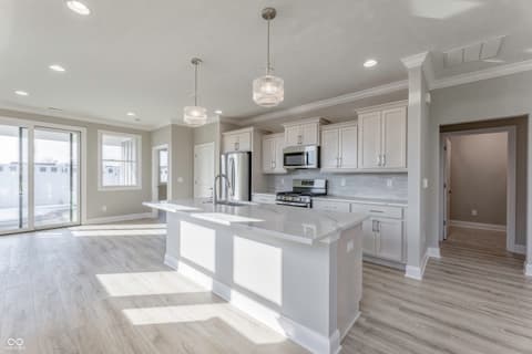 Kitchen at 14890 E Keenan Circle, Westfield, IN — Modern kitchen with white cabinets and quartz island.
