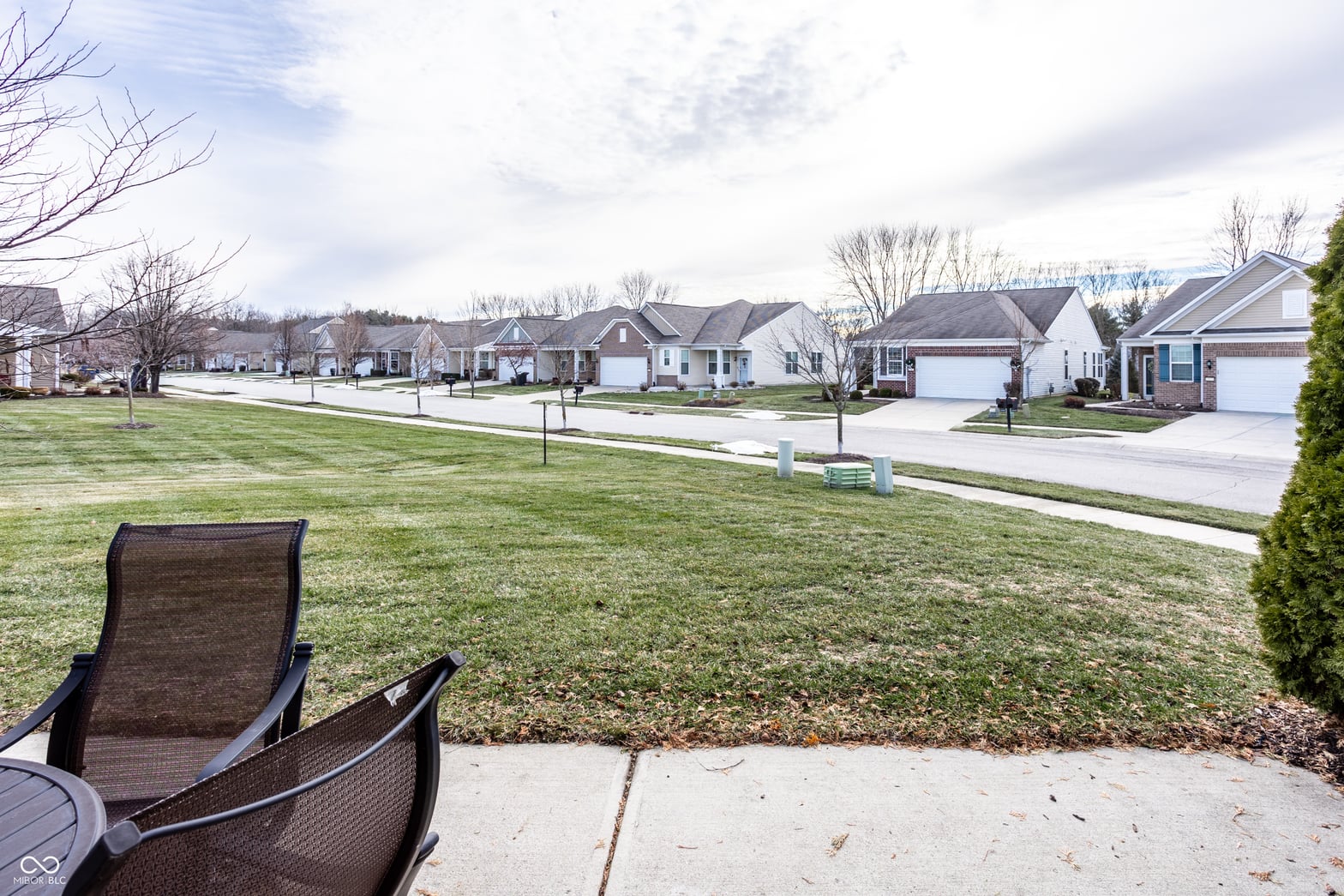 Spacious yard with mature landscaping in established community.