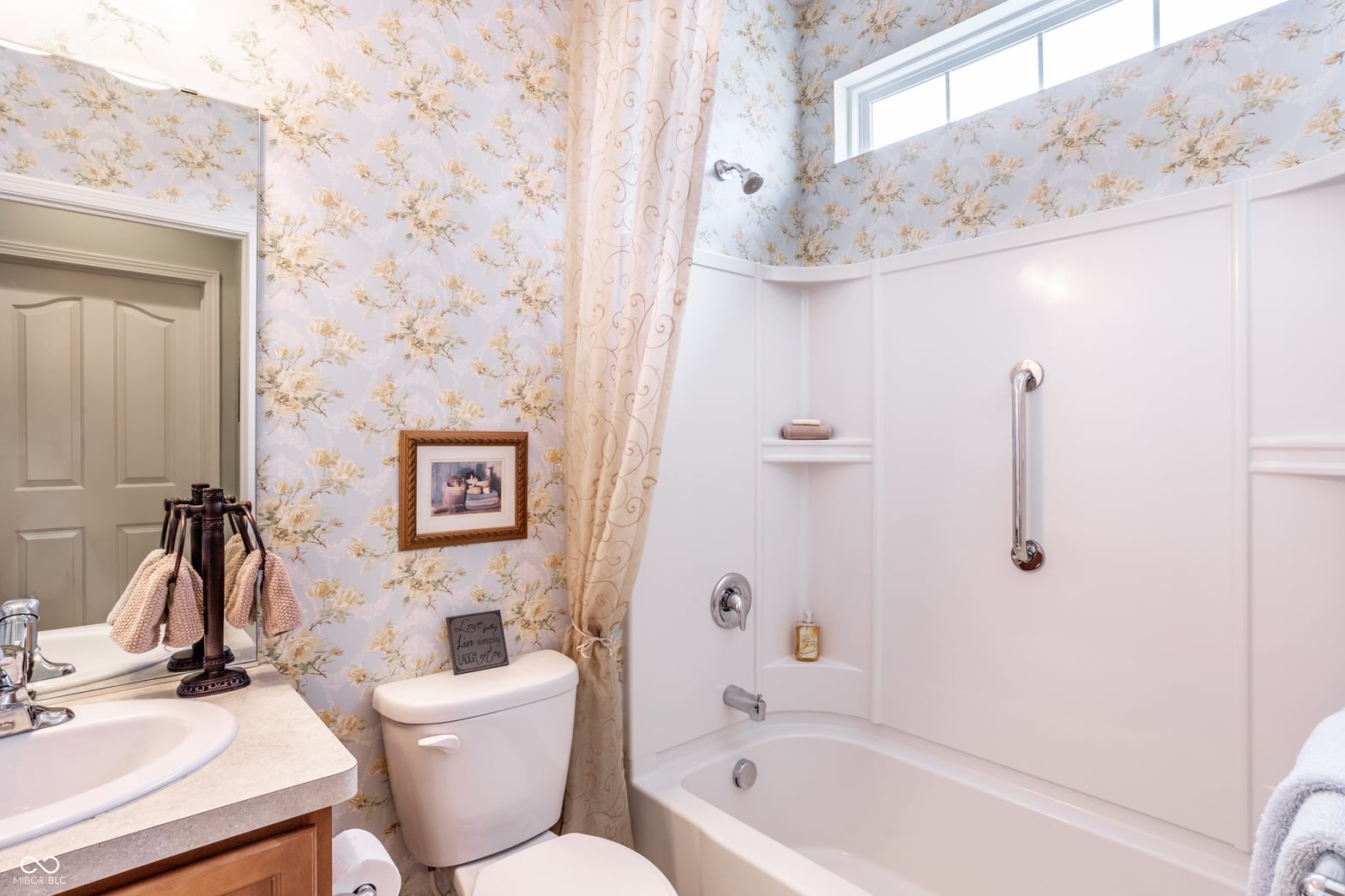 Charming traditional bathroom with updated fixtures and finishes.