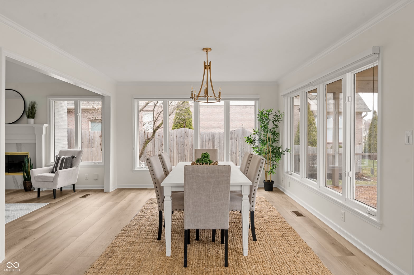 Bright dining room with expansive glass doors and natural light.