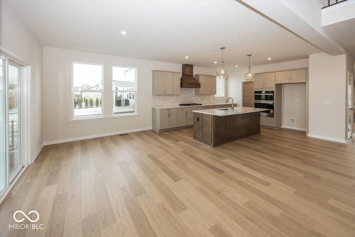 Bright open kitchen with island and modern finishes.