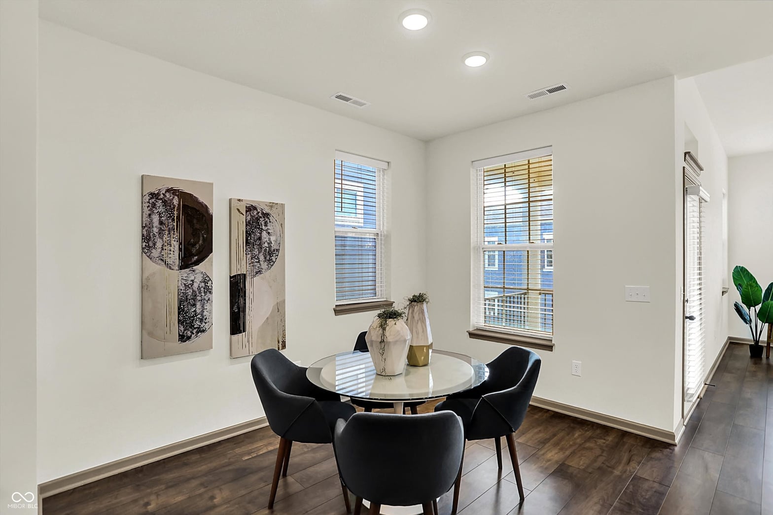 Bright modern dining room with abundant natural light.