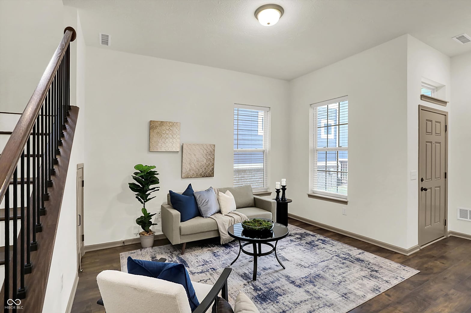 Bright, open living room with abundant natural light and modern finishes.