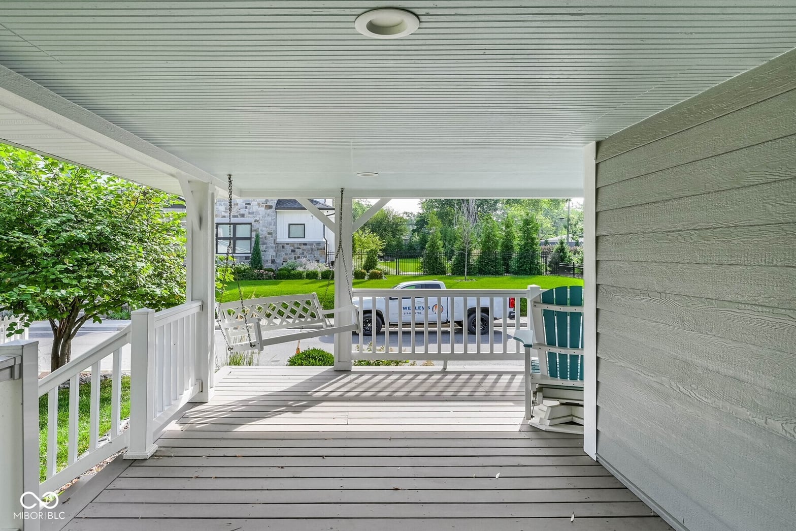Spacious covered deck with expansive yard views.