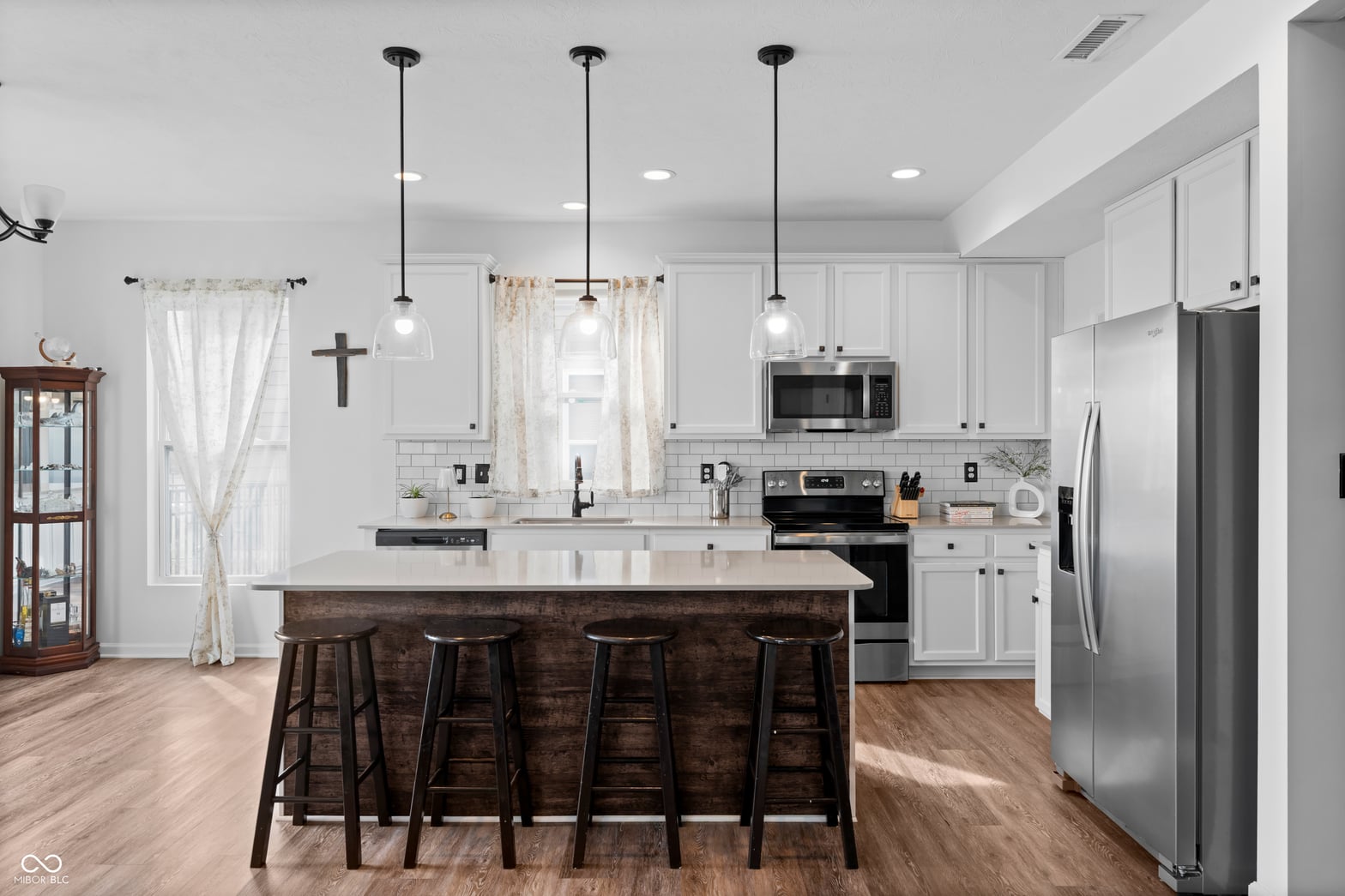 Modern kitchen with large island and premium finishes throughout.