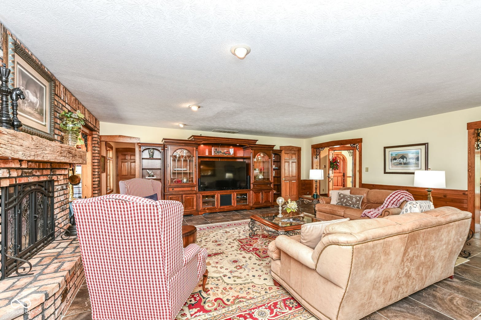 Spacious family room with fireplace and built-in entertainment center.