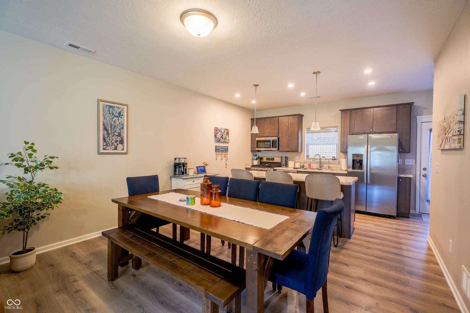 Open-concept dining and kitchen with modern finishes.