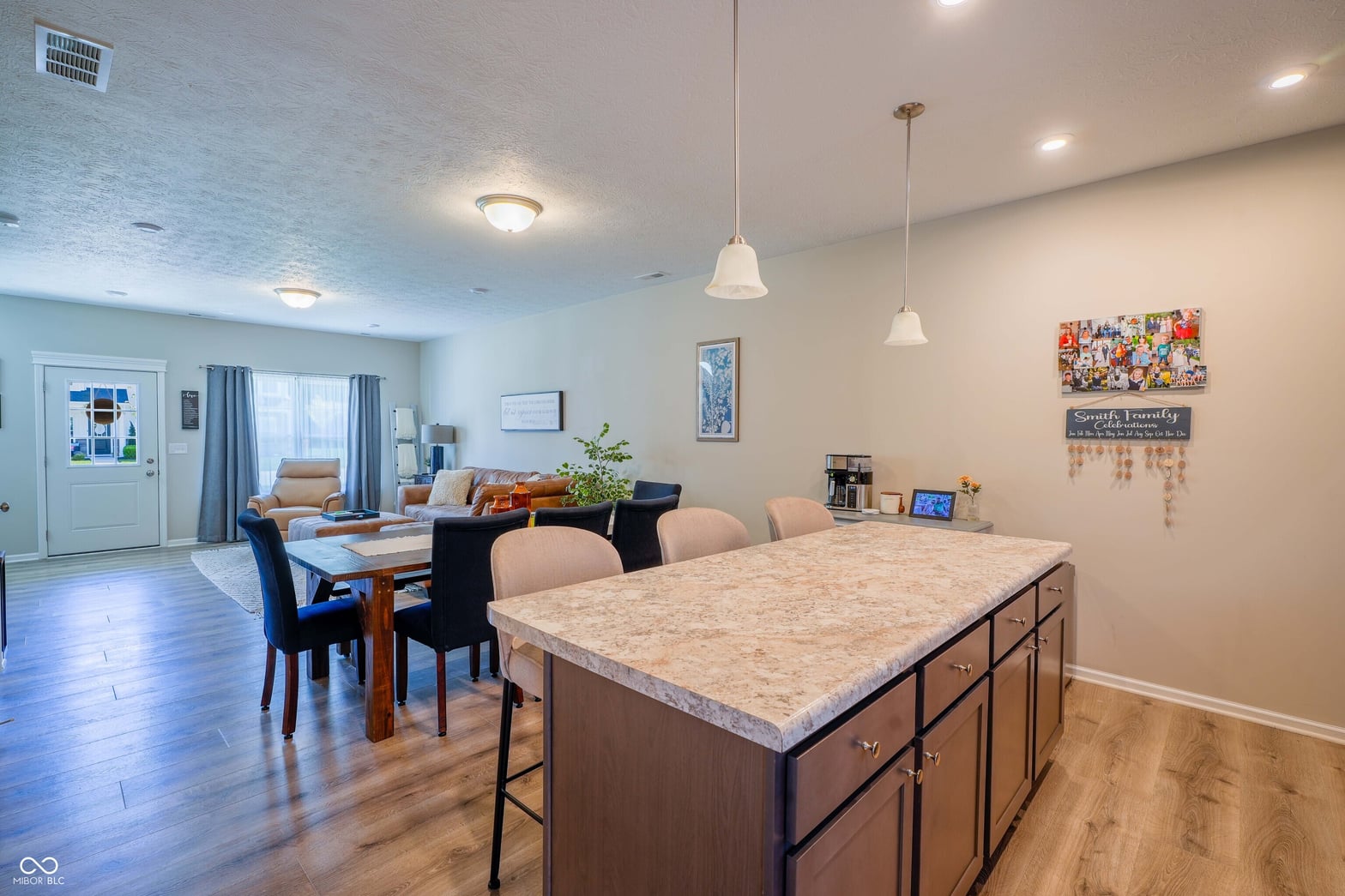 Spacious kitchen with large island and open living area.