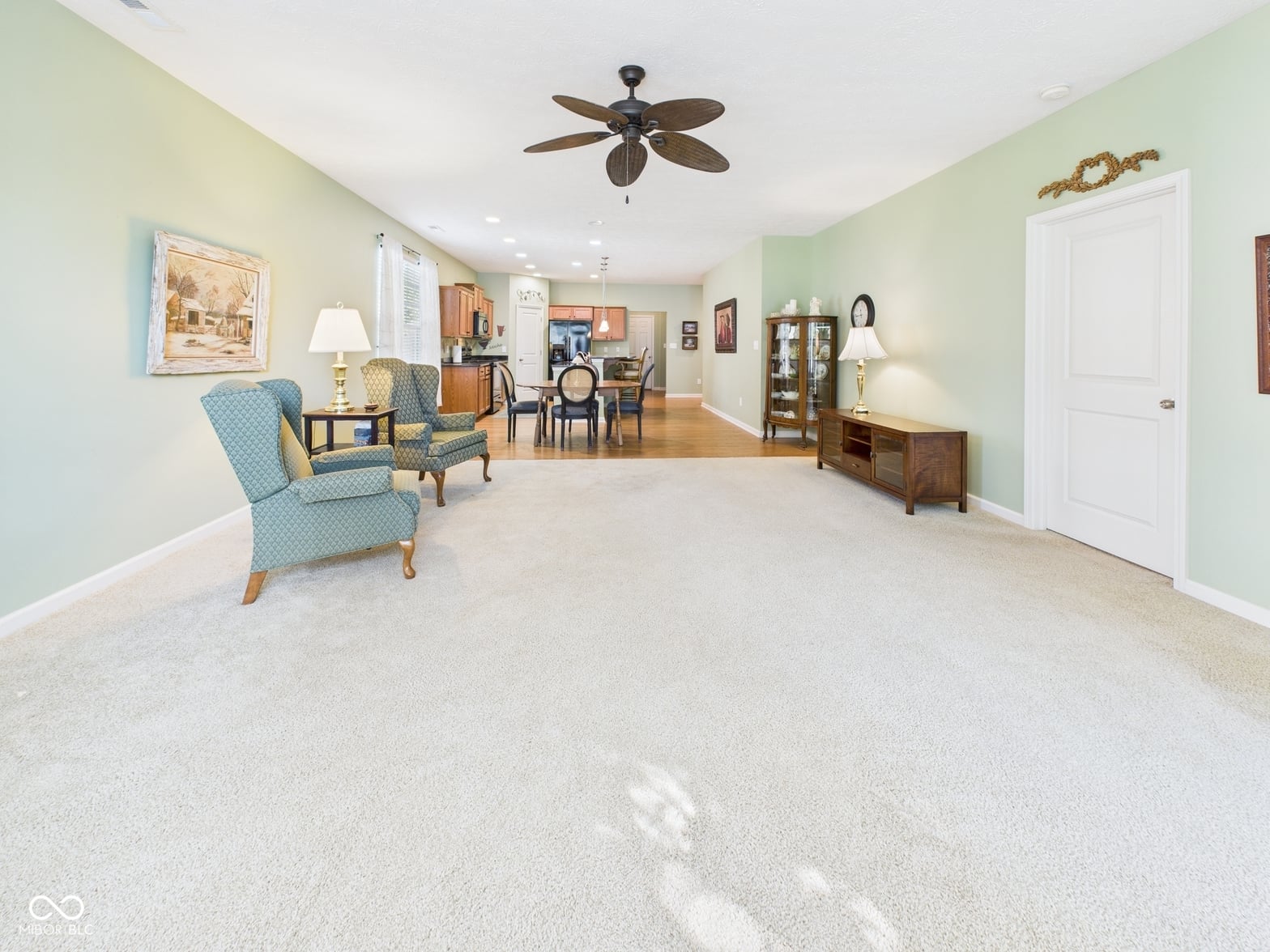 Spacious, light-filled family room with open layout.