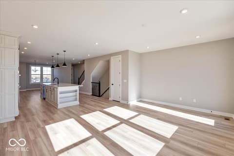 Living room at 408 Elite Street, Westfield, IN — Bright open-concept living space with modern finishes.