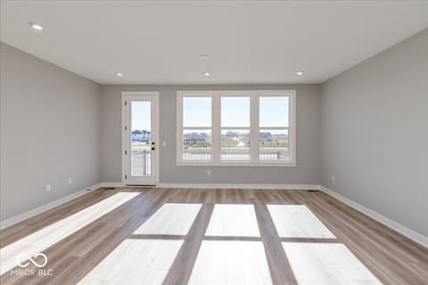 Bonus room at 408 Elite Street, Westfield, IN — Bright bonus room with expansive views and balcony access.