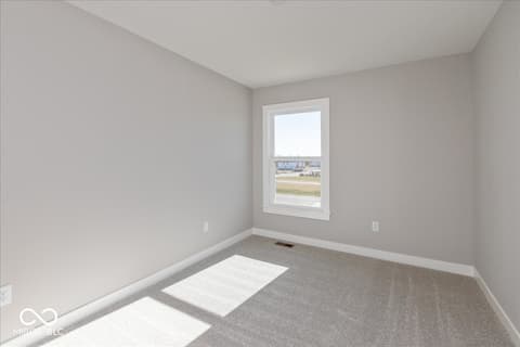 Bedroom at 408 Elite Street, Westfield, IN — Bright bedroom with expansive windows and scenic views.