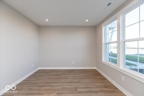 Home office at 406 Elite Street, Westfield, IN — Bright office with hardwood floors and panoramic windows.