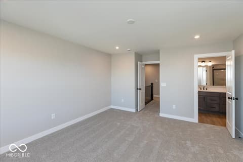 Primary bedroom at 406 Elite Street, Westfield, IN — Bright primary suite with ensuite bath and modern finishes.