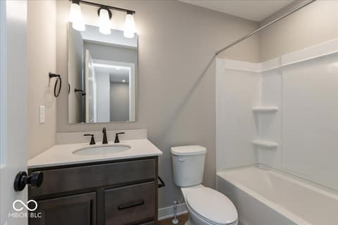 Bathroom at 406 Elite Street, Westfield, IN — Modern bathroom with elegant vanity and soaking tub.