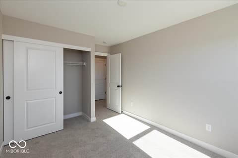 Primary bedroom at 406 Elite Street, Westfield, IN — Spacious primary bedroom with walk-in closet.