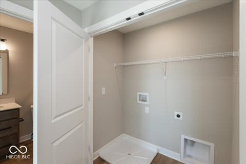 Laundry room at 406 Elite Street, Westfield, IN — Modern laundry room with abundant storage and utilities.