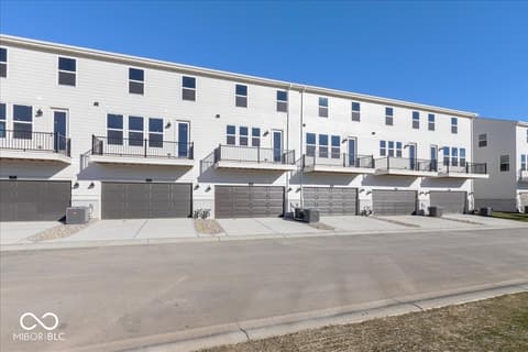 Front exterior at 406 Elite Street, Westfield, IN — Brand new modern townhome community with attached garages.