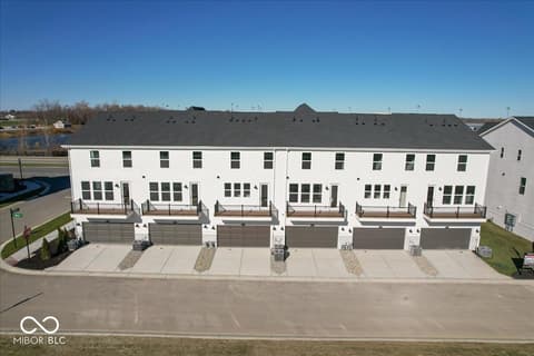 Front exterior at 406 Elite Street, Westfield, IN — Brand new townhome community with attached garages.