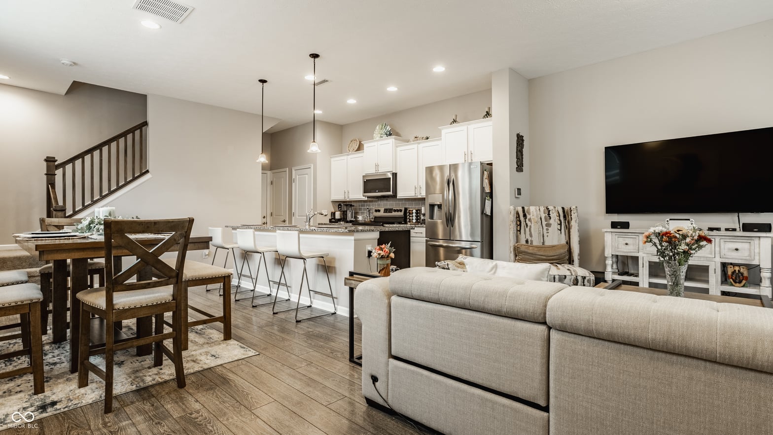 Spacious open-concept living with modern kitchen and family room.