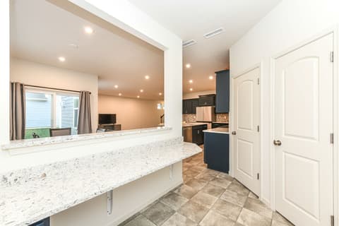 Kitchen at 15104 Downham Drive, Fishers, IN — Modern kitchen with granite counters and stainless steel.