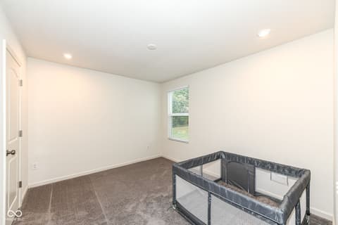 Bedroom at 15104 Downham Drive, Fishers, IN — Bright, spacious bedroom with excellent natural light.
