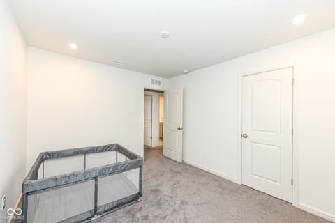Bedroom at 15104 Downham Drive, Fishers, IN — Clean, bright bedroom with neutral finishes and ample space.