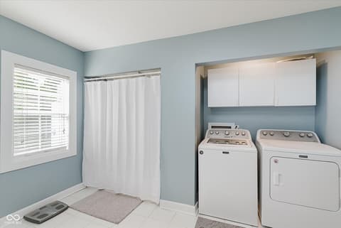 Laundry room at 140 Wiley Street, Cicero, IN — Bright, renovated laundry room with modern appliances.