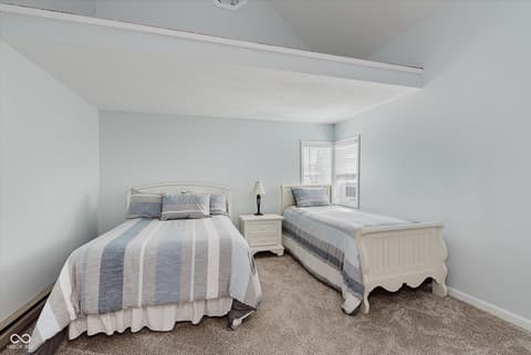 Bedroom at 140 Wiley Street, Cicero, IN — Bright bedroom with vaulted ceiling and dual beds.