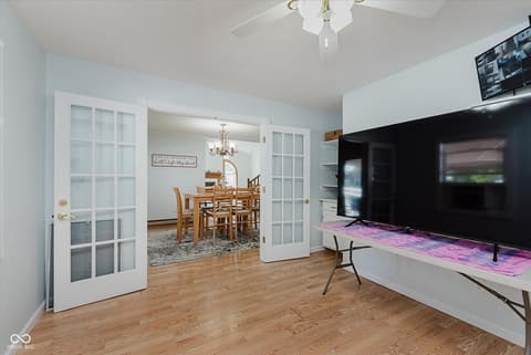 Family room at 140 Wiley Street, Cicero, IN — Bright family room with French doors and hardwood floors.