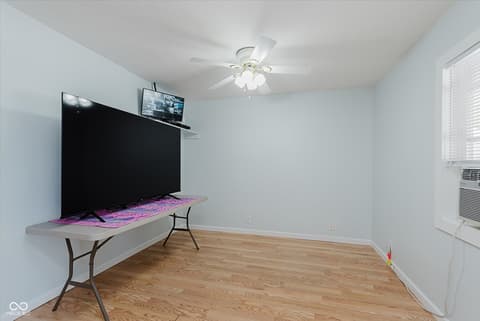 Bedroom at 140 Wiley Street, Cicero, IN — Bright bedroom with hardwood floors and modern amenities.