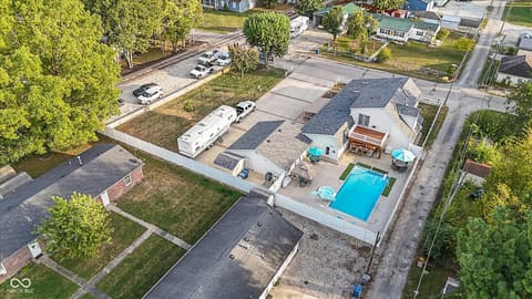 Aerial view at 140 Wiley Street, Cicero, IN — Modern home with resort-style pool and spacious grounds.