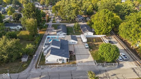 Aerial view at 140 Wiley Street, Cicero, IN — Modern home with pool on private tree-lined lot.