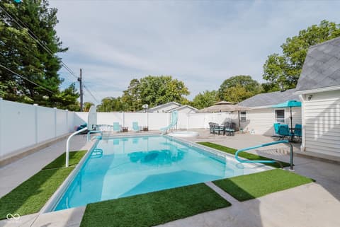 Pool at 140 Wiley Street, Cicero, IN — Sparkling pool with slide and expansive entertainment space.