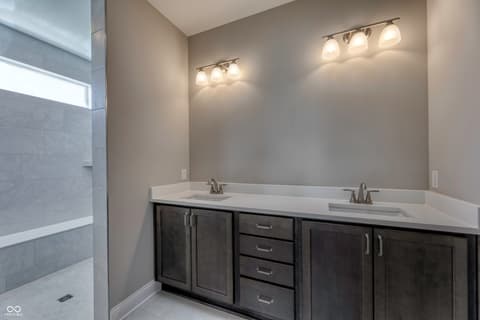 Primary bathroom at 14832 Higgins Drive, Westfield, IN — Luxe primary bath with dual vanity and modern finishes.