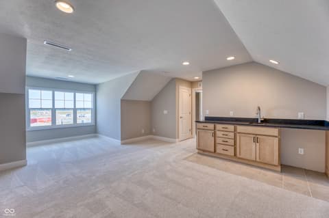 Bonus room at 14832 Higgins Drive, Westfield, IN — Spacious bonus room with wet bar and panoramic windows.