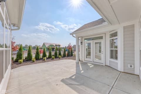 Outdoor living area at 14832 Higgins Drive, Westfield, IN — Expansive patio with premium finishes and scenic views.