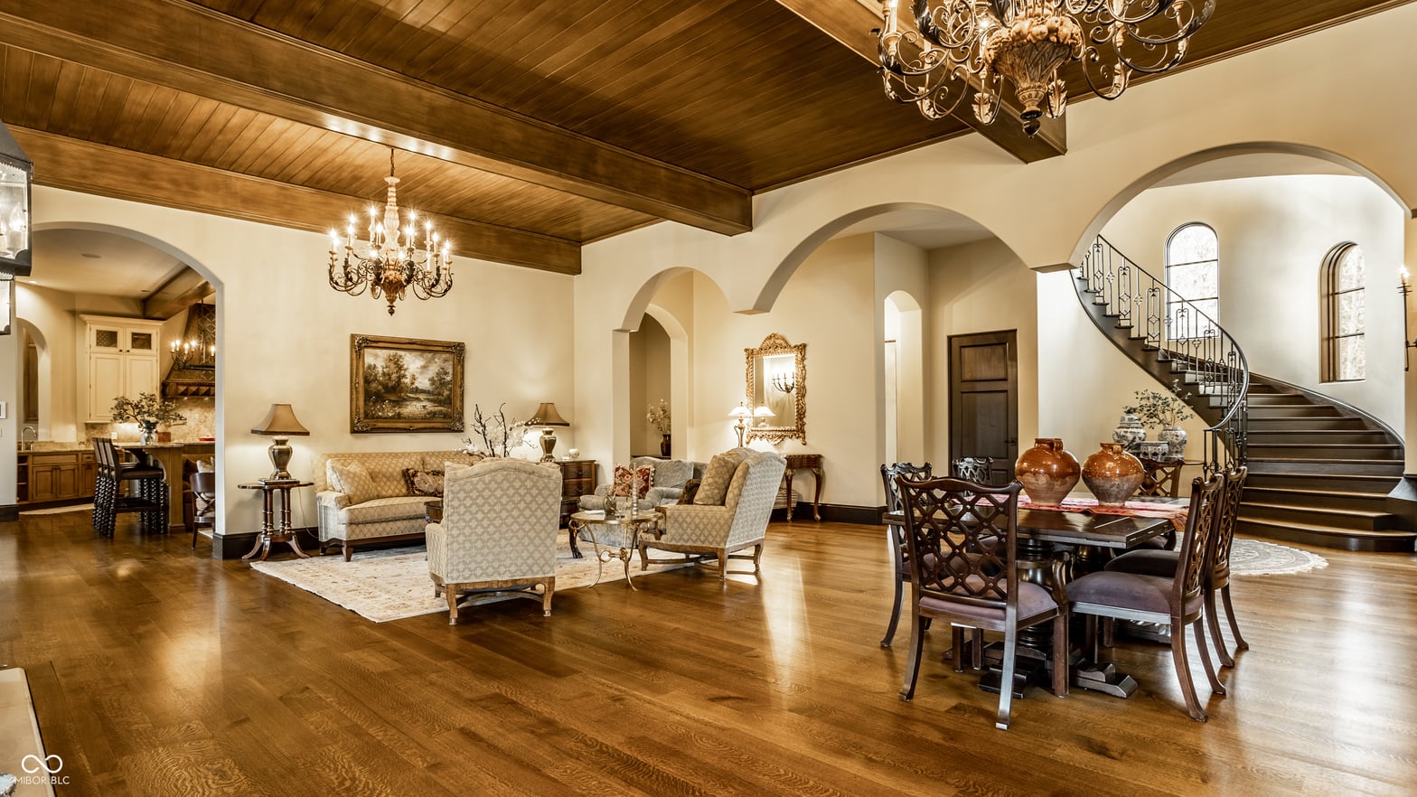 Luxurious open-concept living with soaring arched ceilings.