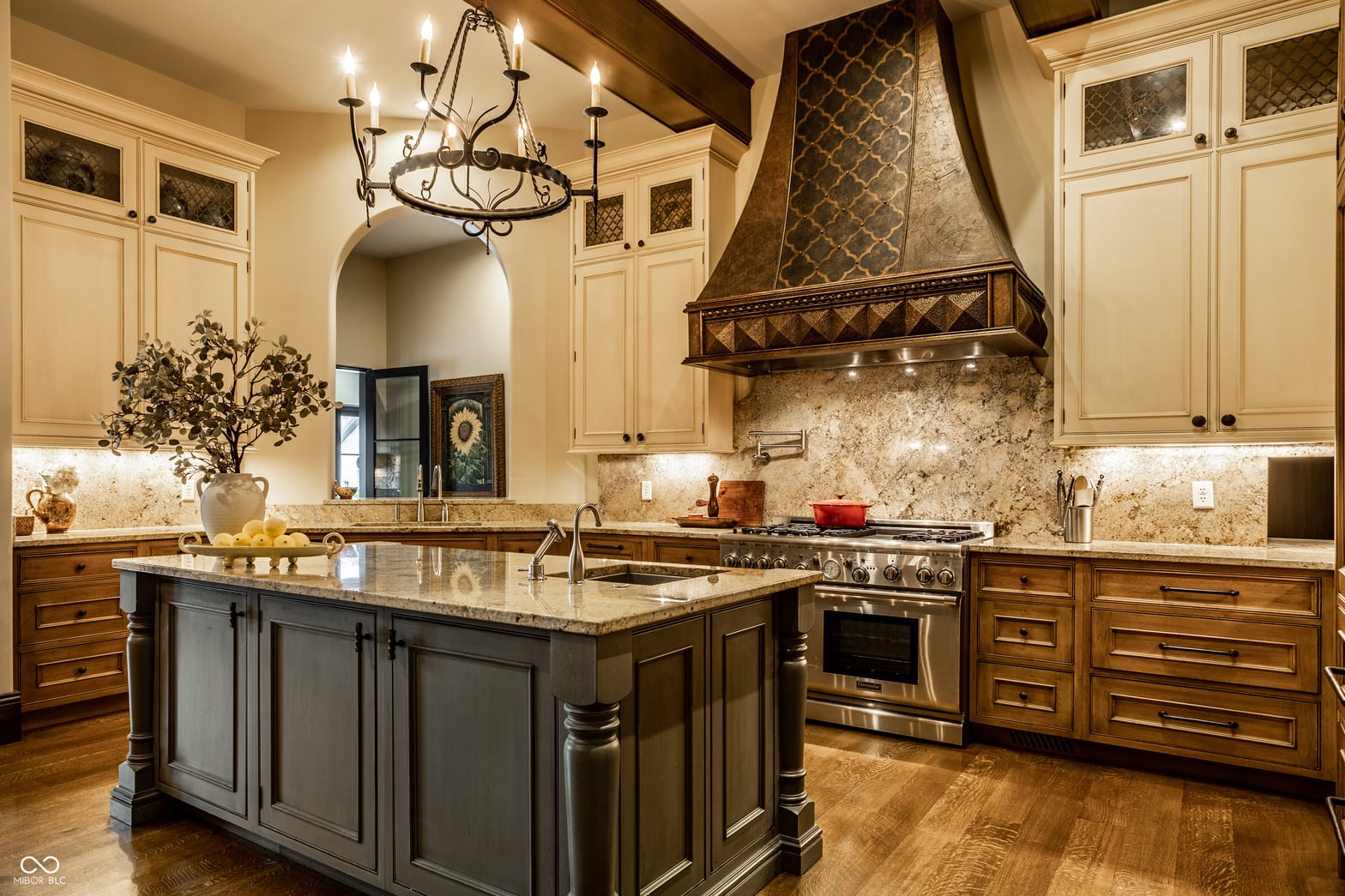 Luxurious chef's kitchen with large island and premium finishes.