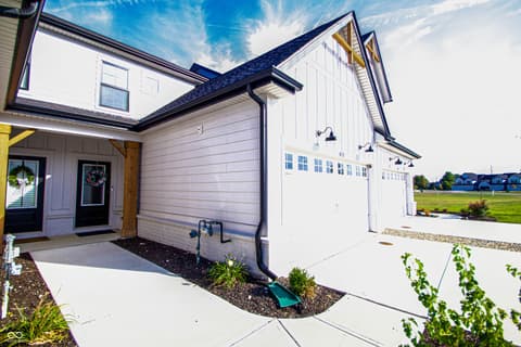 Front exterior at 17521 Gruner Way, Westfield, IN — Modern farmhouse home with spacious two-car garage.