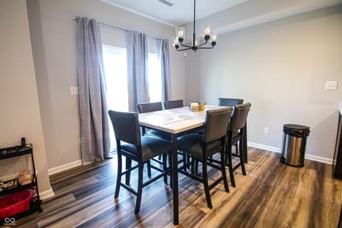 Dining room at 17521 Gruner Way, Westfield, IN — Bright dining area with modern furnishings and patio access.