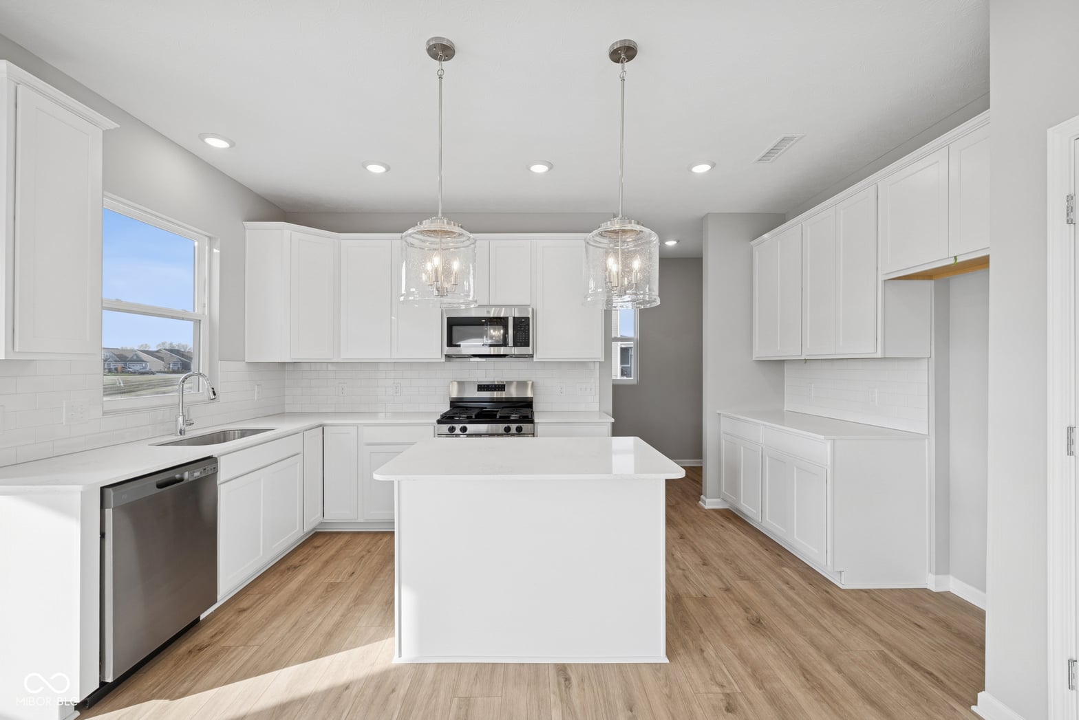 Bright modern kitchen with premium appliances and ample storage.